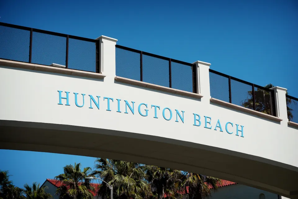 'Huntington Beach' sign on pedestrian bridge over Pacific Coast Highway.